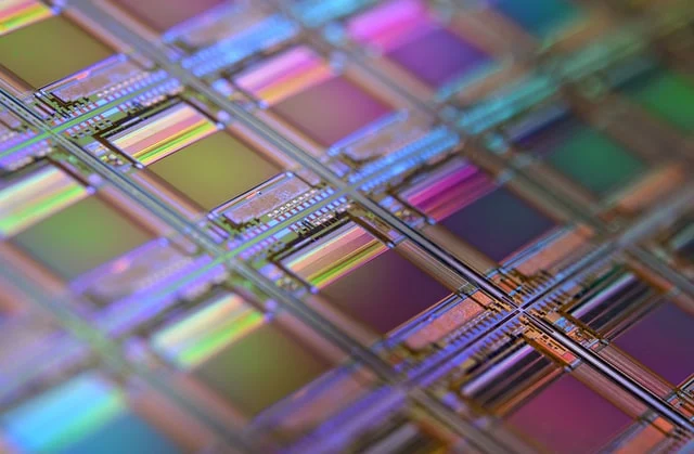 The photo shows a macro of a silicon wafer.